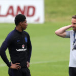 England manager Gareth Southgate speaks to Marcus Rashford during a training session at St George's Park, Burton.