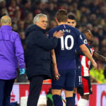 Tottenham Hotspur manager Jose Mourinho pats Harry Kane on the back after he goes off the pitch injured