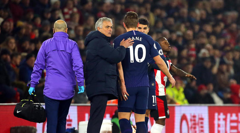 Tottenham Hotspur manager Jose Mourinho pats Harry Kane on the back after he goes off the pitch injured