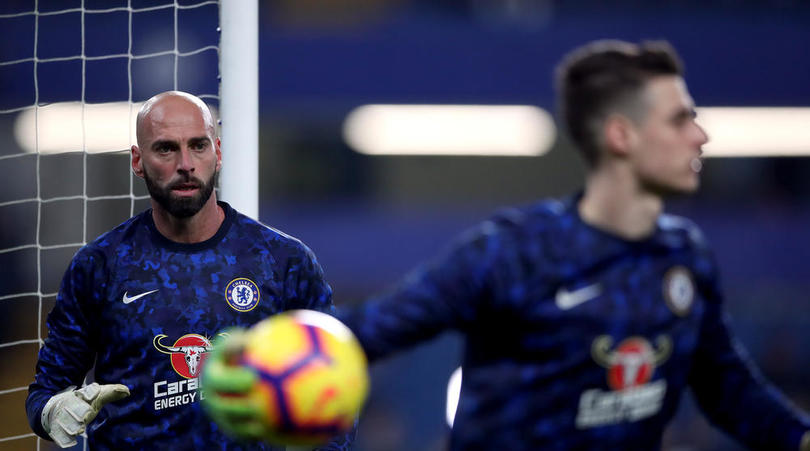 Chelsea goalkeeper Willy Caballero looks on at goalkeeper Kepa Arrizabalaga during the warm up before the Premier League match at Stamford Bridge, London.