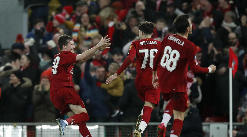 Liverpool players celebrate after Shrewsbury Town's Ro-Shaun Williams, scored an own goal during the FA Cup fourth round replay match at Anfield, Liverpool.