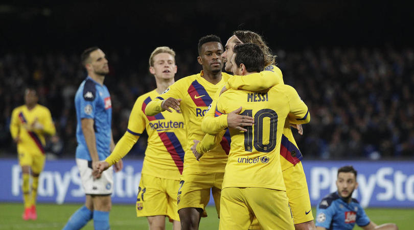 Barcelona's Antoine Griezmann, right, is hugged by teammate Barcelona's Lionel Messi after scoring in the Champions League