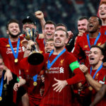 Liverpool's Jordan Henderson celebrates with the trophy after the FIFA Club World Cup final at the Khalifa International Stadium, Doha.