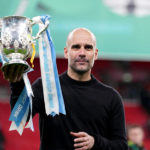 Manchester City manager Pep Guardiola with the trophy after the Carabao Cup Final at Wembley Stadium, London.