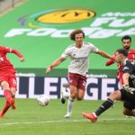 Takumi Minamino of Liverpool scores the equaliser during the FA Community Shield match between Arsenal and Liverpool FC