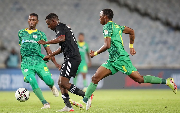 Collins Makgaka of Orlando Pirates challenged by Athinkosi Dlala and Sekela Sithole of Baroka