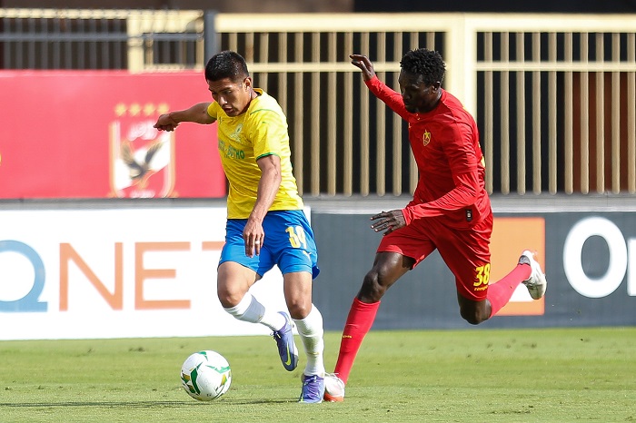 Erwin Saavedra Flores of Mamelodi Sundowns challenged by Bakhit Khamis Mohamed of Al Merrikh during their CAF Champions League clash