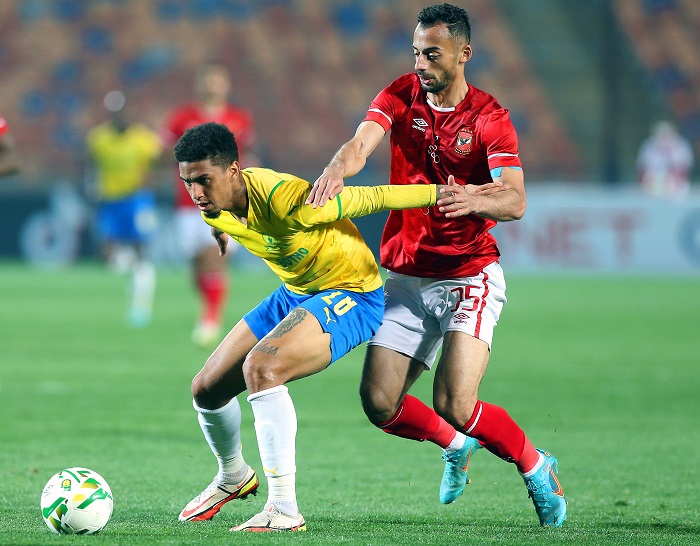 Al Ahly's Ahmed Abdelkader in action against Mamelodi's Rushine De Reuck during the CAF Champions League group A clash