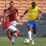 Andile Jali of Mamelodi Sundowns challenged by Mohamed Mousry of Al Ahly SC