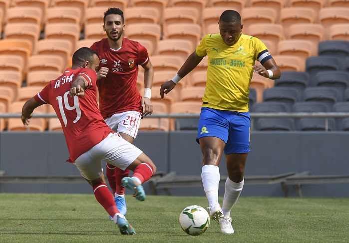 Andile Jali of Mamelodi Sundowns challenged by Mohamed Mousry of Al Ahly SC