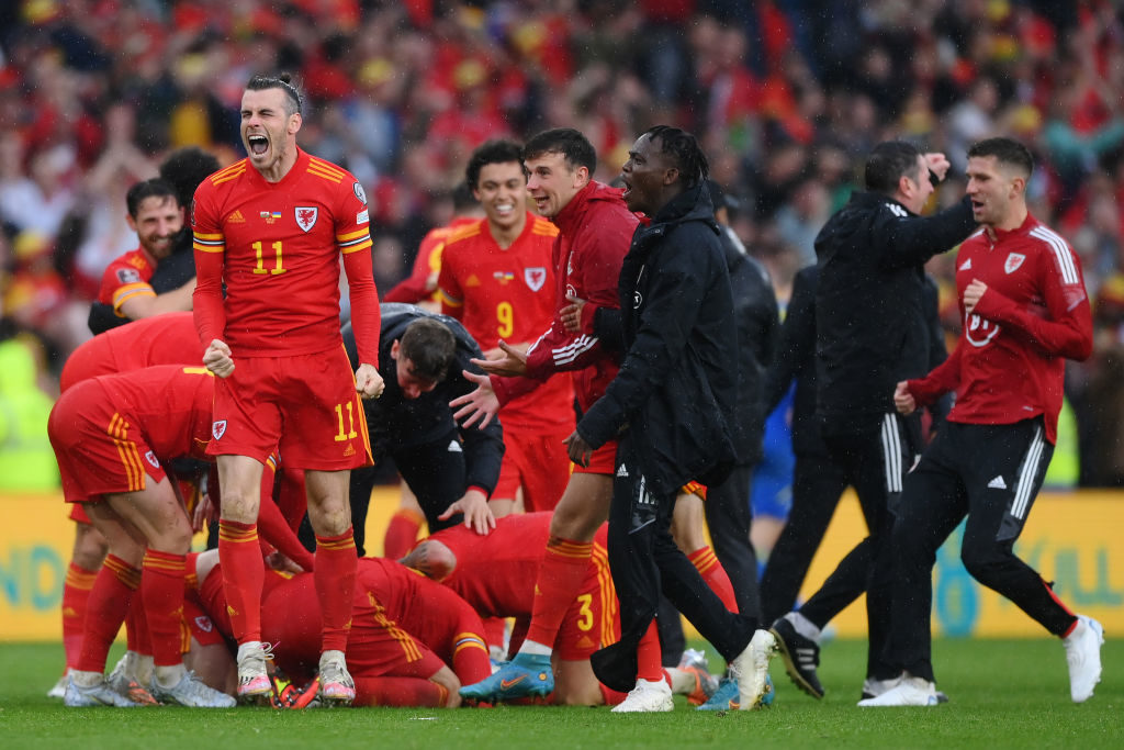 Gareth Bale of Wales celebrates with teammates after their sides victory, which qualifies Wales for the 2022 FIFA World Cup during the FIFA World Cup Qualifier between Wales and Ukraine at Cardiff City Stadium on June 05, 2022 in Cardiff, Wales. (Photo by Shaun Botterill/Getty Images)