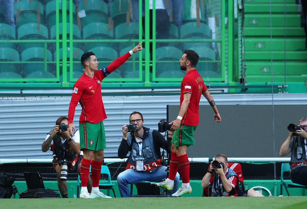 Cristiano Ronaldo of Portugal celebrates with team mate Bruno Fernandes after scoring their sides third goal during the UEFA Nations League League A Group 2 match between Portugal and Switzerland at Estadio Jose Alvalade on June 05, 2022 in Lisbon, Portugal. (Photo by Carlos Rodrigues/Getty Images)