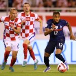 Christopher Nkunku of France runs with the ball whilst under pressure from Domagoj Vida of Croatia during the UEFA Nations League League A Group 1 match between Croatia and France at Stadion Poljud on June 06, 2022 in Split, Croatia. (Photo by Jurij Kodrun/Getty Images)