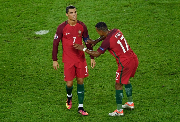 PARIS, FRANCE - JUNE 18: Cristiano Ronaldo of Portugal reacts with Nani of Portugal after missing a penalty during the UEFA EURO 2016 Group F match between Portugal and Austria at Parc des Princes on June 18, 2016 in Paris, France. (Photo by Mike Hewitt/Getty Images)