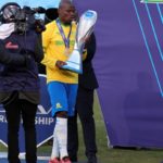 Hlompho Kekana of Mamelodi Sundowns receive a trophy from DSTV representative during the DStv Premiership 2020/21 match between Mamelodi Sundowns and Cape Town City at Loftu Versfeld Stadium, Pretoria, on 05 June 2021 ©Samuel Shivambu/BackpagePix