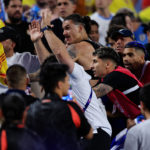 Darwin Nuñez (C) of Uruguay reacts towards fans in the stands