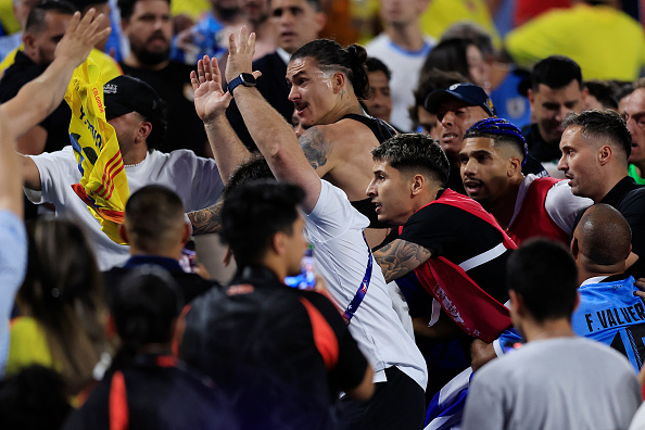 Darwin Nuñez (C) of Uruguay reacts towards fans in the stands